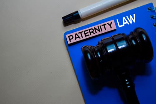gavel on paternity law notepad on desk