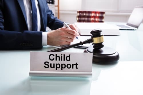 child support lawyer at desk with gavel and paperwork