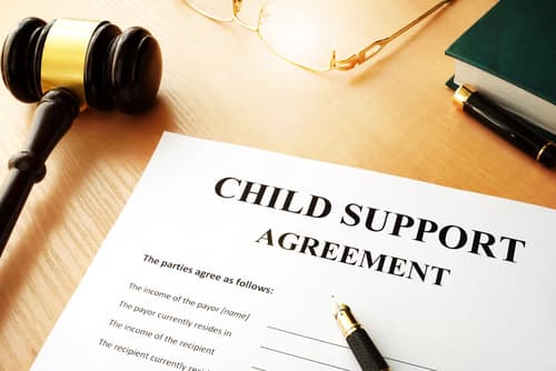 child support agreement on table next to gavel