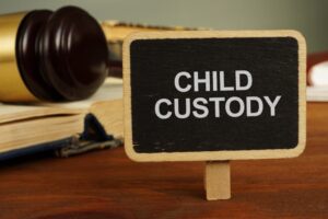 Conceptual hand writing text showing child custody