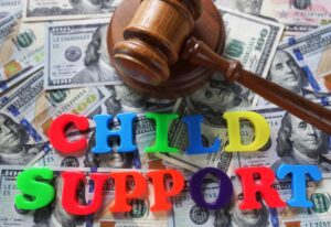 Child Support letters with gavel and cash