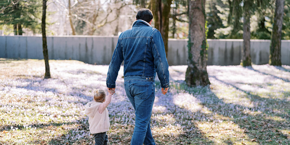 Father and daughter walking hand-in-hand concept image, representing parenting time and fathers’ rights advocacy in Barrington, Illinois